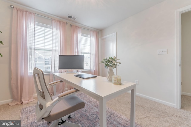 office with light carpet, visible vents, and baseboards