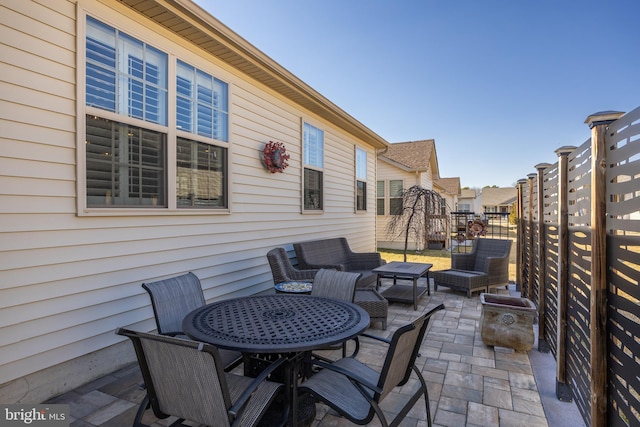 view of patio / terrace featuring outdoor dining area and an outdoor hangout area