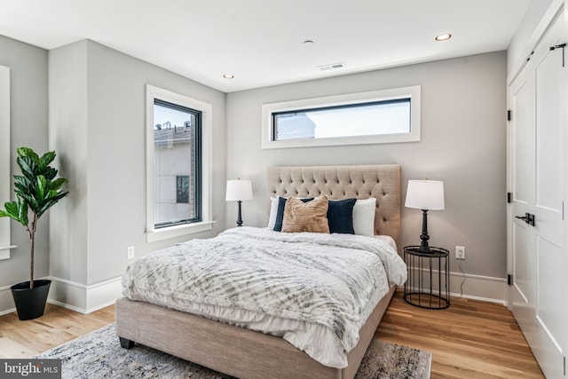 bedroom with light hardwood / wood-style flooring