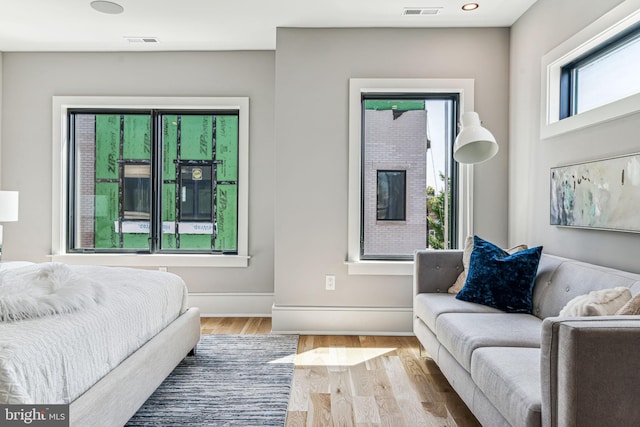 bedroom with light hardwood / wood-style flooring