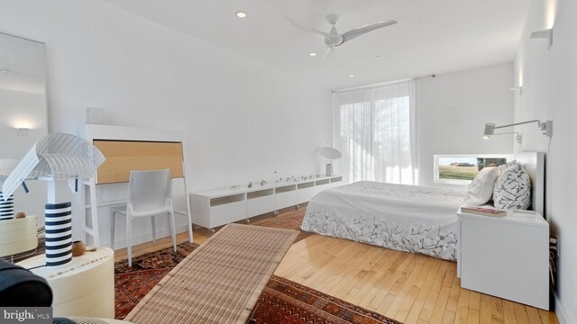 bedroom featuring recessed lighting and wood-type flooring