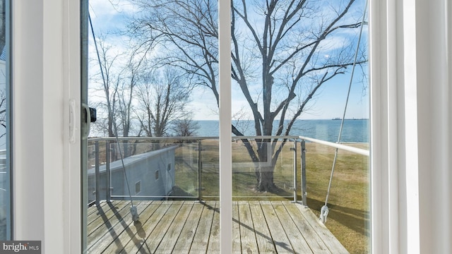 balcony featuring a water view