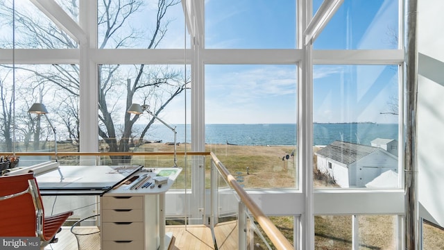 sunroom with a water view