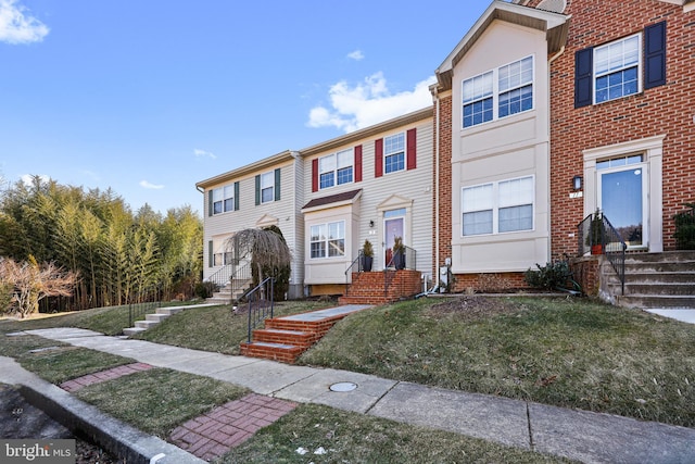 view of property featuring a front yard