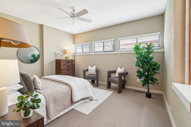 carpeted bedroom with baseboards and ceiling fan