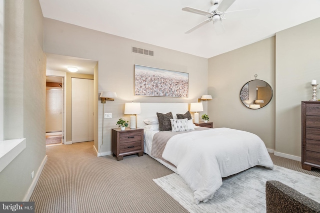 bedroom with visible vents, carpet, baseboards, and ceiling fan