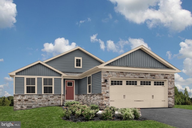 craftsman-style home with a garage and a front lawn