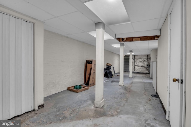 basement featuring a drop ceiling