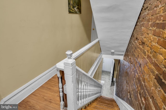 stairs with hardwood / wood-style flooring