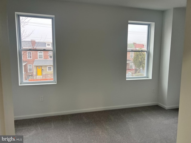 spare room featuring carpet