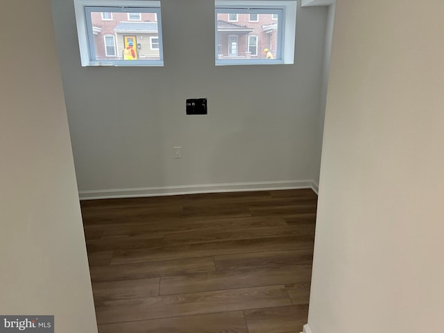 laundry room featuring dark wood-type flooring
