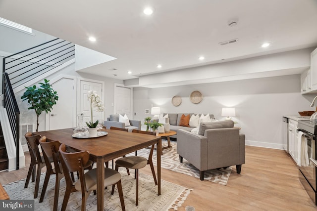 dining area with light hardwood / wood-style floors