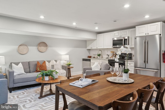 dining space featuring sink