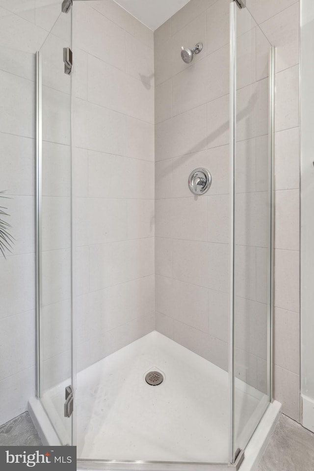bathroom featuring an enclosed shower