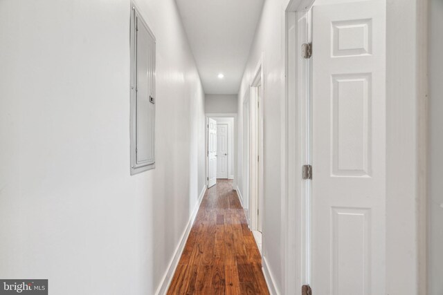 hall with dark wood-type flooring