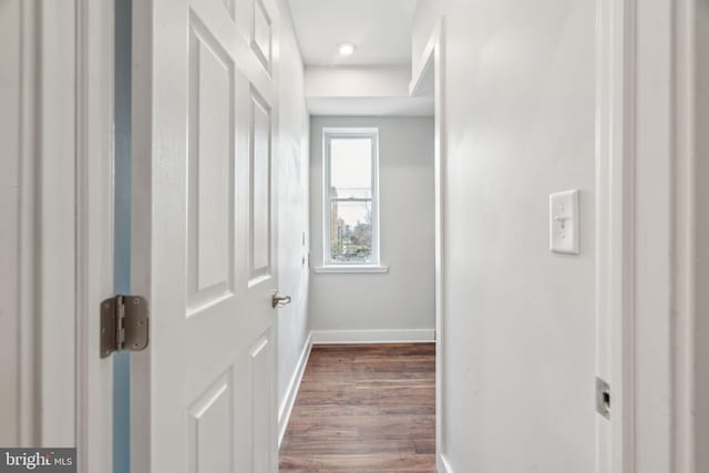 hallway featuring dark hardwood / wood-style floors