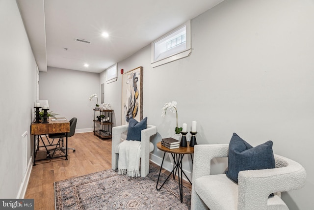 sitting room featuring wood-type flooring