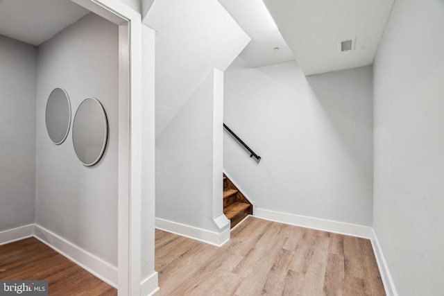stairway featuring hardwood / wood-style floors