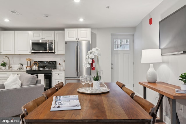 dining space with sink