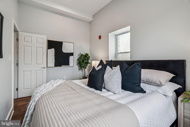 bedroom featuring dark wood-type flooring