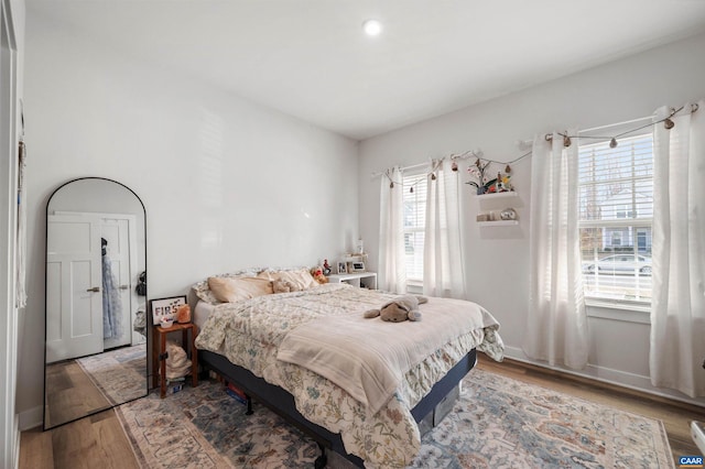 bedroom featuring hardwood / wood-style flooring