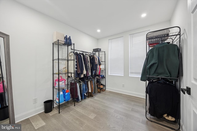 walk in closet featuring light wood-style flooring