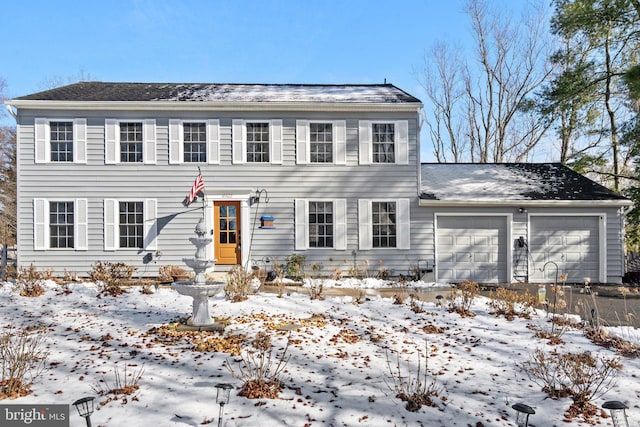 colonial-style house with a garage