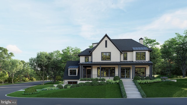 view of front facade with a garage, a front yard, and covered porch