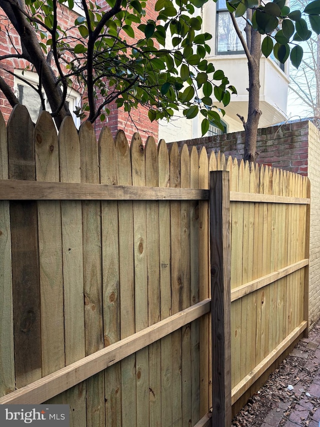 view of gate featuring fence