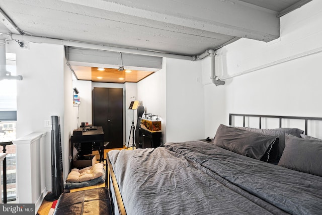 bedroom with wood-type flooring