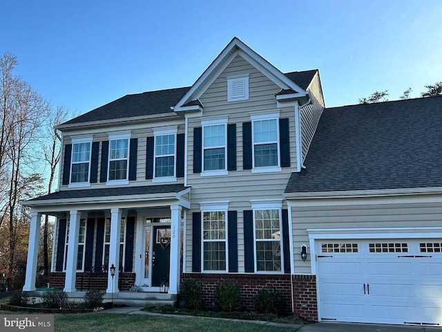 view of front of house featuring a garage and covered porch