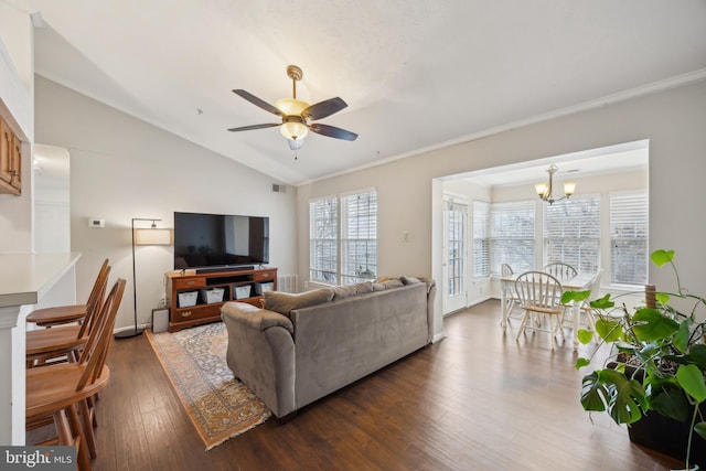 living room with lofted ceiling, ceiling fan with notable chandelier, dark hardwood / wood-style flooring, and crown molding