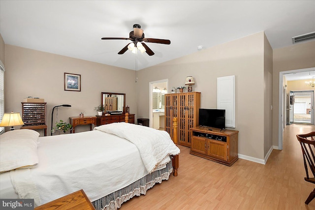 bedroom with ceiling fan, ensuite bath, and light hardwood / wood-style flooring