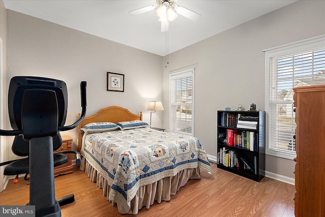 bedroom featuring ceiling fan and light hardwood / wood-style floors