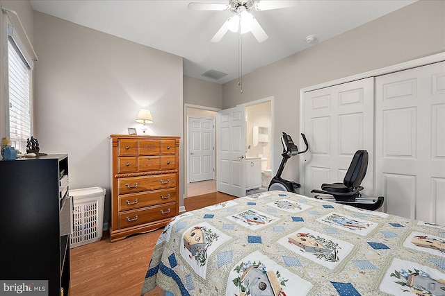 bedroom featuring a closet, ensuite bathroom, ceiling fan, and light hardwood / wood-style flooring