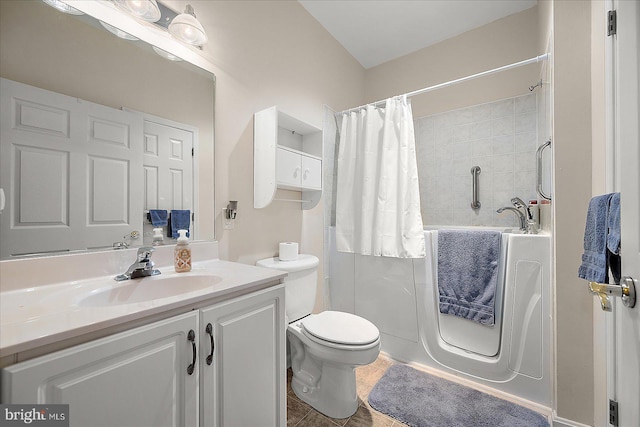 bathroom with vanity, curtained shower, tile patterned floors, and toilet