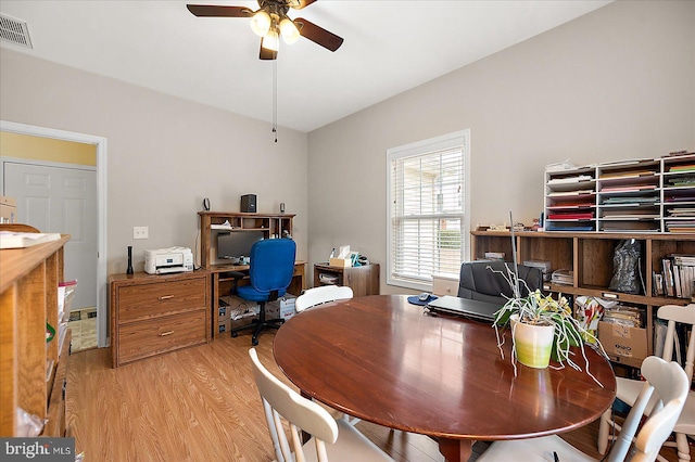 dining area with ceiling fan and light wood-type flooring