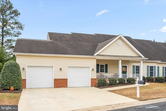 view of front of property featuring a garage and covered porch