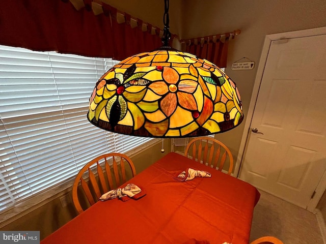 dining room featuring carpet flooring