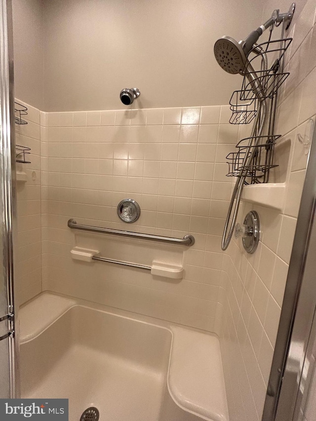 full bath with a shower stall