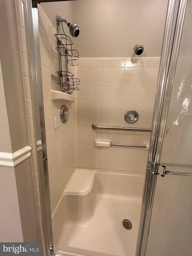 full bathroom with a shower stall