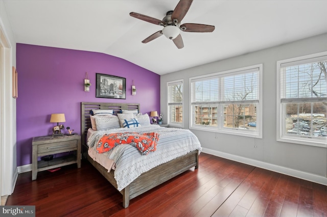 bedroom with lofted ceiling, dark wood-type flooring, and ceiling fan