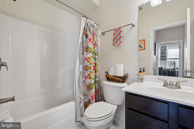 full bathroom with vanity, shower / bath combination with curtain, and toilet