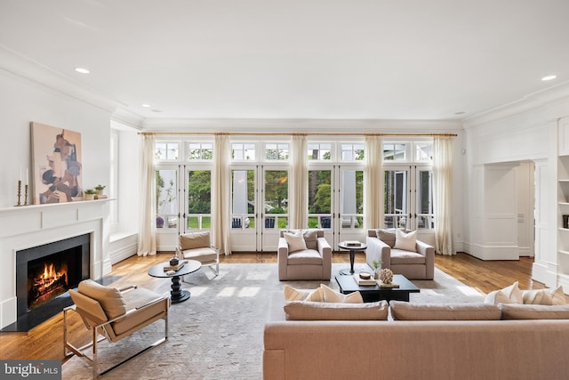 948 Melvin Rd, Annapolis, MD 21403 - living room with ornamental molding, a fireplace with flush hearth, french doors, wood finished floors, and recessed lighting