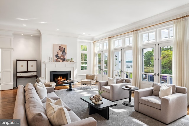 948 Melvin Rd, Annapolis, MD 21403 - living room with crown molding, a warm lit fireplace, wood finished floors, and recessed lighting