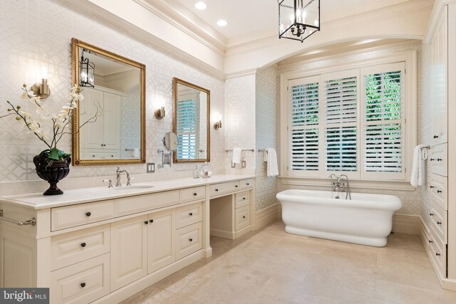 948 Melvin Rd, Annapolis, MD 21403 - bathroom featuring ornamental molding, a soaking tub, vanity, a chandelier, and tile patterned flooring