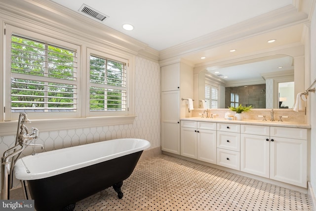 948 Melvin Rd, Annapolis, MD 21403 - full bathroom featuring ornamental molding, a soaking tub, healthy amount of natural light, and double vanity
