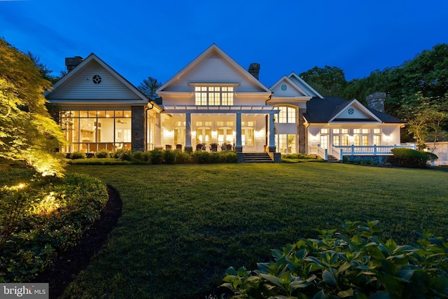 948 Melvin Rd, Annapolis, MD 21403 - rear view of house featuring a pergola, a chimney, a lawn, and a deck
