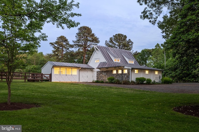 948 Melvin Rd, Annapolis, MD 21403 - view of front facade with a standing seam roof, gravel driveway, stone siding, an outbuilding, and metal roof