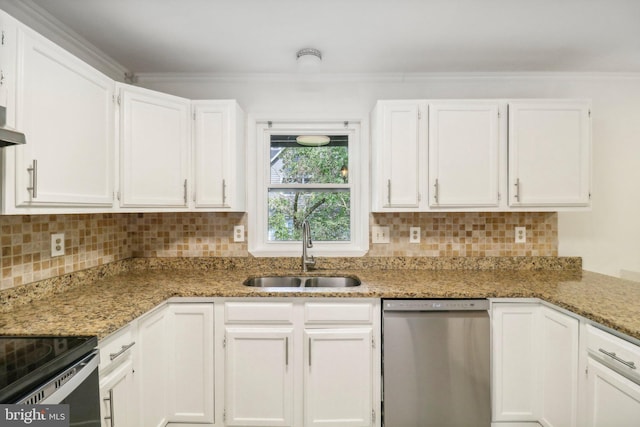 kitchen with stainless steel appliances, sink, white cabinets, and light stone counters